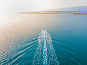 Aerial view of small boat on Adriatic sea in Vrsi, Croatia.