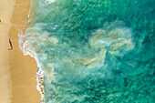 Aerial view of a person on the beach at Playa de los Amantes, Cabo San Lucas, Baja California, Mexico.