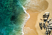 Aerial view of a person on the beach at Playa de los Amantes, Cabo San Lucas, Baja California, Mexico.
