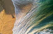 Aerial view of a person on the beach at Playa de los Amantes, Cabo San Lucas, Baja California, Mexico.