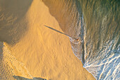 Aerial view of a person on the beach at Playa de los Amantes, Cabo San Lucas, Baja California, Mexico.
