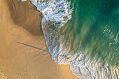 Aerial view of a person on the beach at Playa de los Amantes, Cabo San Lucas, Baja California, Mexico.