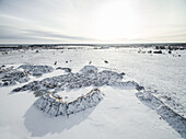 Aerial view of snowy countryside landscape in Estonia.