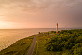 Aerial view of Pakri lighthouse on Pakri peninsula at sunset in Estonia.