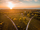 Aerial view of sunset on forest on the coast in Estonia.