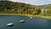 Aerial view of traditional tourist safari boats on famous tourist location Bacina lakes near the city of Ploce in Dalmatia, Croatia.