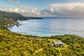 Aerial view of Long Harry Hut and Long Harry Bay with Cave Point, Stewart Island, New Zealand.