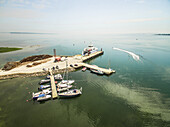 Aerial view of a jetski driving close to the harbour on Vormsi Island in Estonia