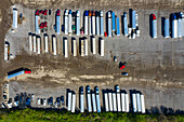 Aerial view of parked semi trucks and cars at a parking lot in Romeoville, IL - USA