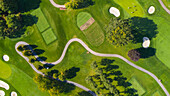 Aerial view of a golf course fairway and sand traps in autumn creating an abstract looking perspective at Arrowhead Golf Course in Wheaton, IL - USA