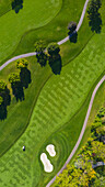 Aerial view of a golf course fairway and sand traps in autumn creating an abstract looking perspective at Arrowhead Golf Course in Wheaton, IL
