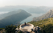 Aerial view of breathtaking mountains and serene bay from viewpoint Kotor, Cetinje, Montenegro.