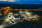 Aerial view of a huge parking lot with parked trucks in St. Augustine county, Florida.