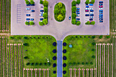 Aerial view of a small parking lot next to the vineyard near the Lake Ontario, Canada.