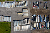 Aerial view of parked semi trucks and cars at a parking lot in Romeoville, IL - USA