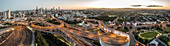Panoramic aerial view of the Inner City Bypass & Airport Link highway interchange with Brisbane City in the background, Bowen Hills, Brisbane, Queensland, Australia.