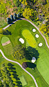 Aerial view of a golf course fairway and sand traps in autumn creating an abstract looking perspective at Arrowhead Golf Course in Wheaton, IL - USA