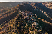 Aerial view of Civita di Bagnoreggio, a beautiful old town with badlands (Calanchi) in background, Viterbo, Lazio, Italy.