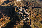 Aerial view of Civita di Bagnoreggio, a beautiful old town with badlands (Calanchi) in background, Viterbo, Lazio, Italy.