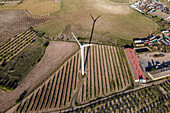 Aerial view of many wind turbines in a wind farm in countryside, La Muela, Zaragoza, Spain.