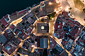 Aerial top down view of Sitges city hall at sunset along the Mediterranean Sea, Barcelona, Spain.