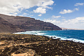 Aerial view of the northernmost point of Lanzarote island with La Graciosa island in background, Lanzarote, Canary Islands, Spain.