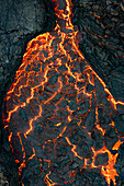 Aerial view of flowing lava from a volcanic eruption with a scenic landscape, Sundhnukur, Grindavik, Iceland.