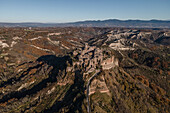 Aerial view of Civita di Bagnoreggio, a beautiful old town with badlands (Calanchi) in background, Viterbo, Lazio, Italy.