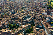 Aerial view of Piazza dell'Anfiteatro, a medieval square with cafè and market in Lucca old town, Tuscany, Italy.