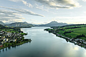 Aerial view of Mount Pilatus at sunset from Lake Lucerne, a mountain peak in Alpnach, Switzerland.