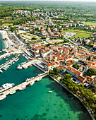 Aerial view of Fazana, a small town with a small harbour along the Adriatic Sea coastline, Istria, Croatia.