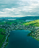 Aerial view of Kussnacht am Rigi, a small town along the Lake Lucerne at sunset with the Lake Zug (Zugersee) in background, Schwyz, Switzerland.