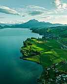 Aerial view of Mount Pilatus at sunset from Lake Lucerne, a mountain peak in Alpnach, Switzerland.