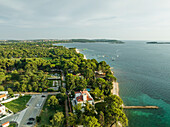 Aerial view of the Adriatic Sea coastline at sunset near Pula, Istria, Croatia.