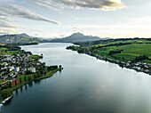 Aerial view of Mount Pilatus at sunset from Lake Lucerne, a mountain peak in Alpnach, Switzerland.