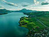 Aerial view of Mount Pilatus at sunset from Lake Lucerne, a mountain peak in Alpnach, Switzerland.