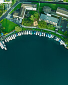 Aerial view of boats moored along Lake Lucerne at sunset, Kussnacht am Rigi, Schwyz, Switzerland.