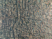 Aerial view of dense urban rooftops and crowded streets in Paharganj, New Delhi, India.
