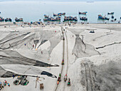 Aerial view of fishing boats at fishery ghat with nets along the shoreline, Cox Bazar, Bangladesh.