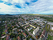 Aerial view of urban residential buildings and streets with greenery and trees, Lorrach, Baden-Wurttemberg, Germany.