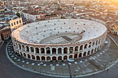 Aerial view of verona arena and historic architecture at sunset, verona, italy.