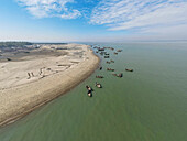 Aerial view of fishing boats at fishery ghat along the coastline of Bay of Bengal, Cox Bazar, Bangladesh.