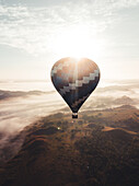 Aerial view of a hot air balloon at sunset in Villafuerte, Bohol, Philippines