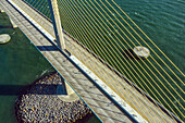 Aerial view of modern suspension bridge over aqua water, Sunshine Bridge, Tampa Bay, United States.