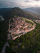Aerial view of historic berat castle overlooking a beautiful village and surrounding mountains, Berat, Albania.