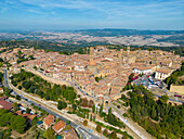 Aerial view of historic town with medieval architecture and scenic rooftops, Volterra, Province of Pisa, Italy.