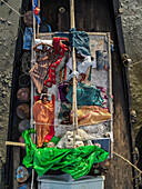 Chittagong, Bangladesh - 10 September 2022: Aerial view of fishing boats and fishermen on a vibrant river, Chittagong, Bangladesh.