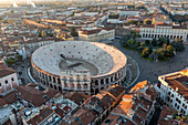 Aerial view of the beautiful verona arena and historic piazza bra surrounded by medieval buildings, Verona, Italy.