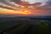 Aerial view of tranquil sunset over rural farmland, Grossaffoltern, Switzerland.