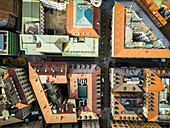 Aerial view of colorful historic buildings and rooftops in the vibrant old town, Lugano, Switzerland.